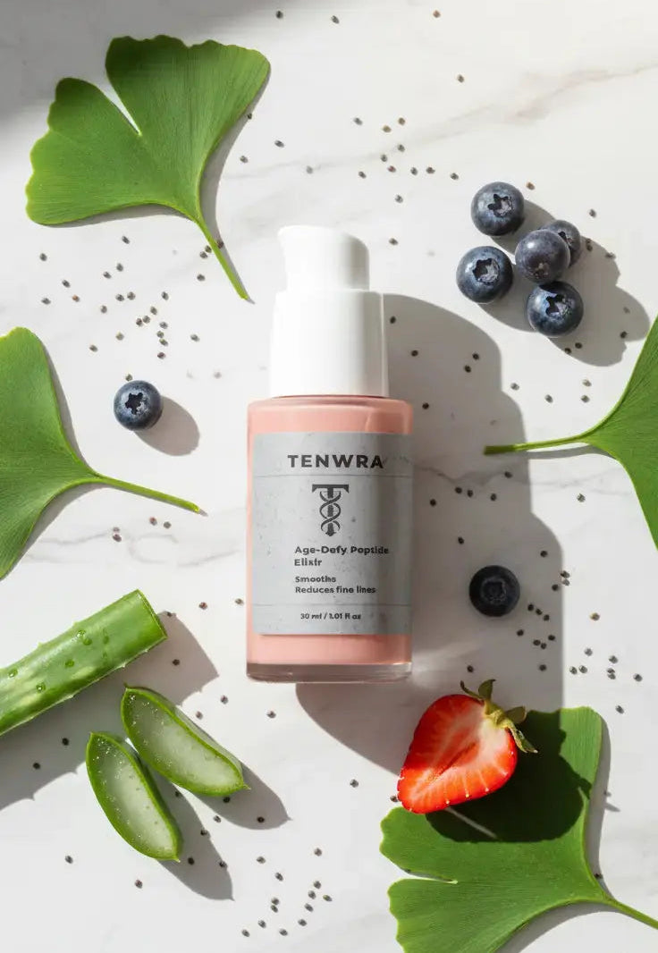 Tenwra skincare dropper bottle on a white background with green leaves and blueberries.