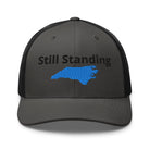 Still Standing - Hurricane Helene Natural Disaster Relief Trucker Hat TENWRA™